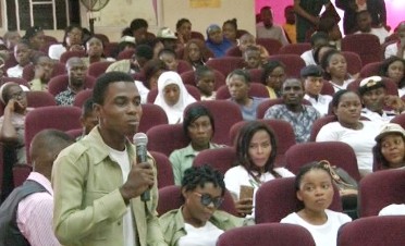 A participant speaks from the floor